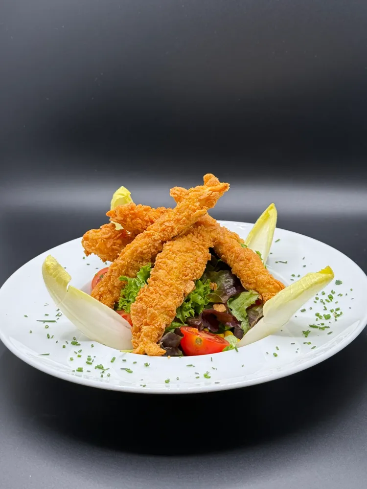 Deep-fried chicken breast strips breaded with corn flakes
