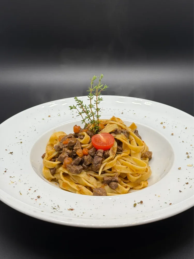 Homemade tagliatelle with hand-cut venison